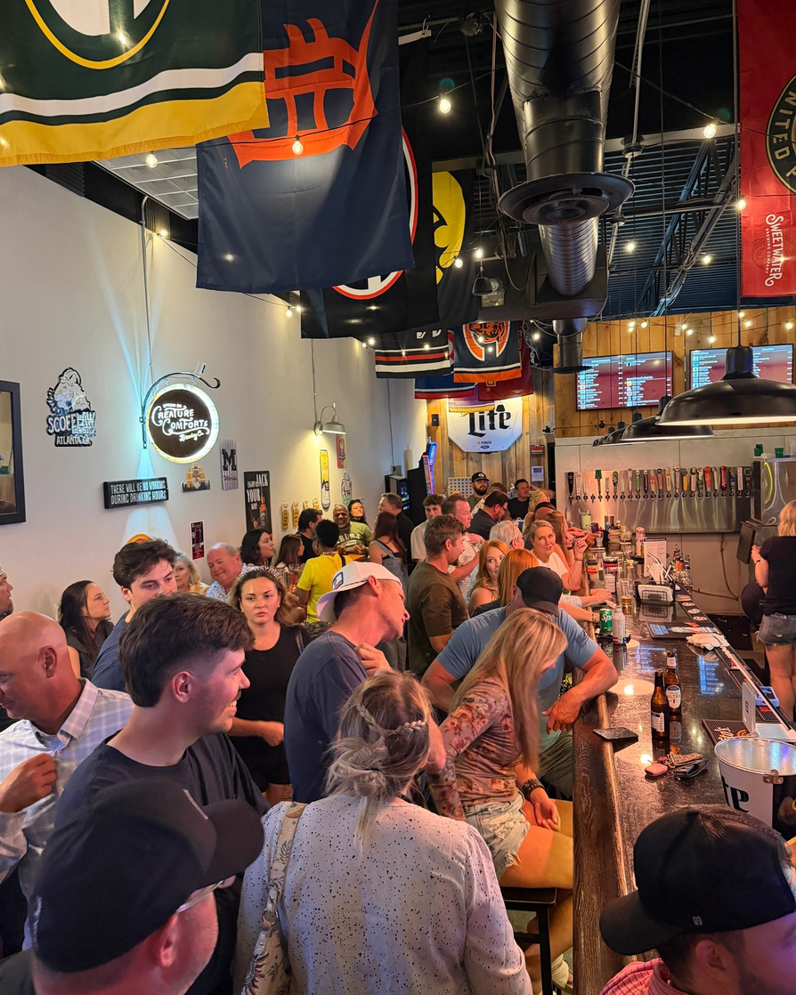 Bar counter with team flags and crowd